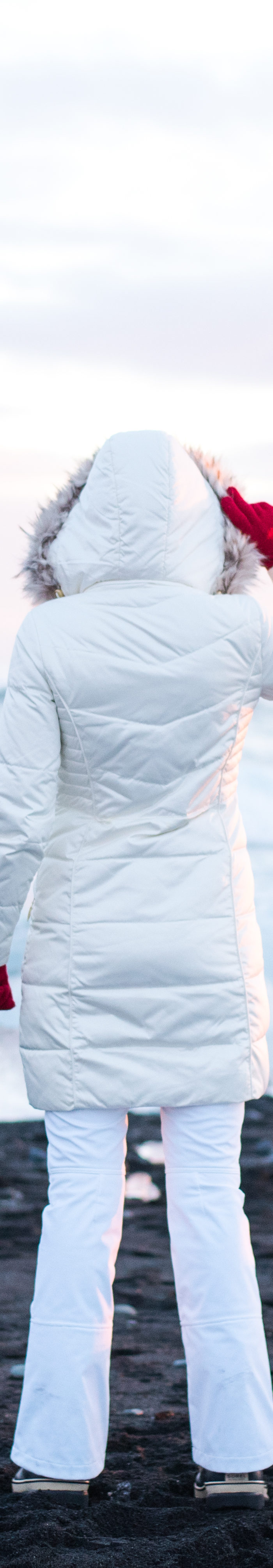 Miss USA 2011 Alyssa Campanella of The A List blog wearing Ellen Tracy faux fur coat and Sorel Caribou boots and North Face APEX snow pants in Jökullsárlón, Iceland