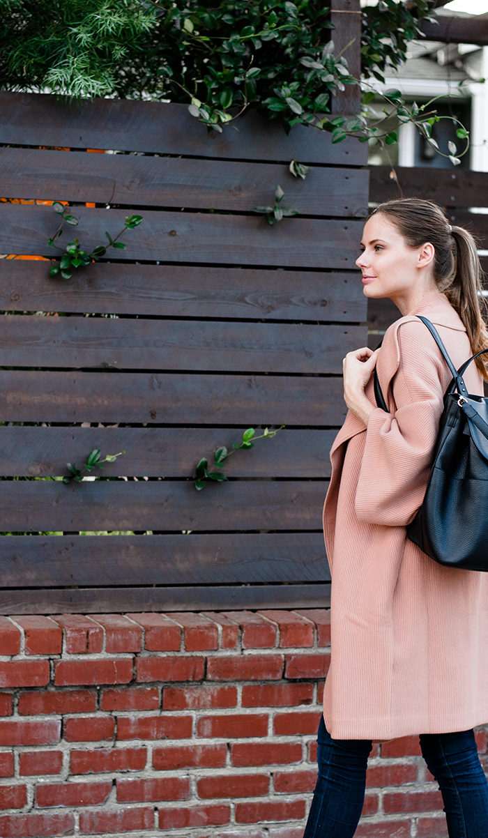 Alyssa Campanella of The A List blog in her travel style wearing Alice & Olivia Hester coat and Cuyana backpack