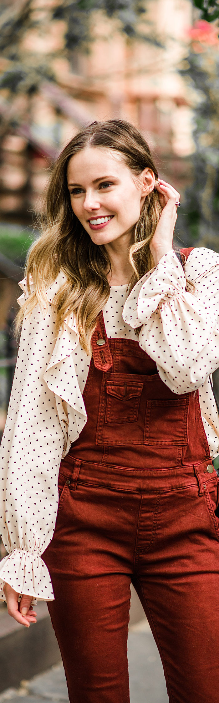 Alyssa Campanella of The A List blog enjoys autumn in New York wearing Free People washed denim overalls and Clare V Alistair bag