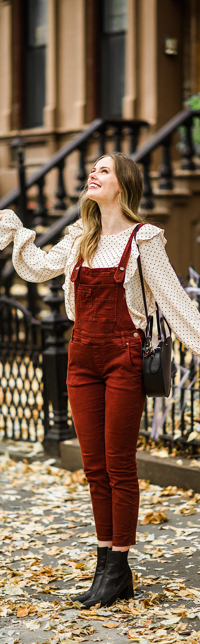 Alyssa Campanella of The A List blog enjoys autumn in New York wearing Free People washed denim overalls and Clare V Alistair bag