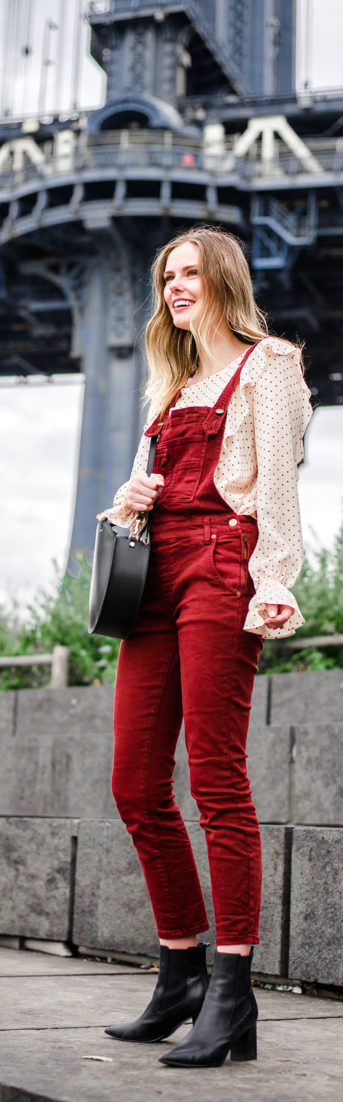 Alyssa Campanella of The A List blog enjoys autumn in New York wearing Free People washed denim overalls and Clare V Alistair bag