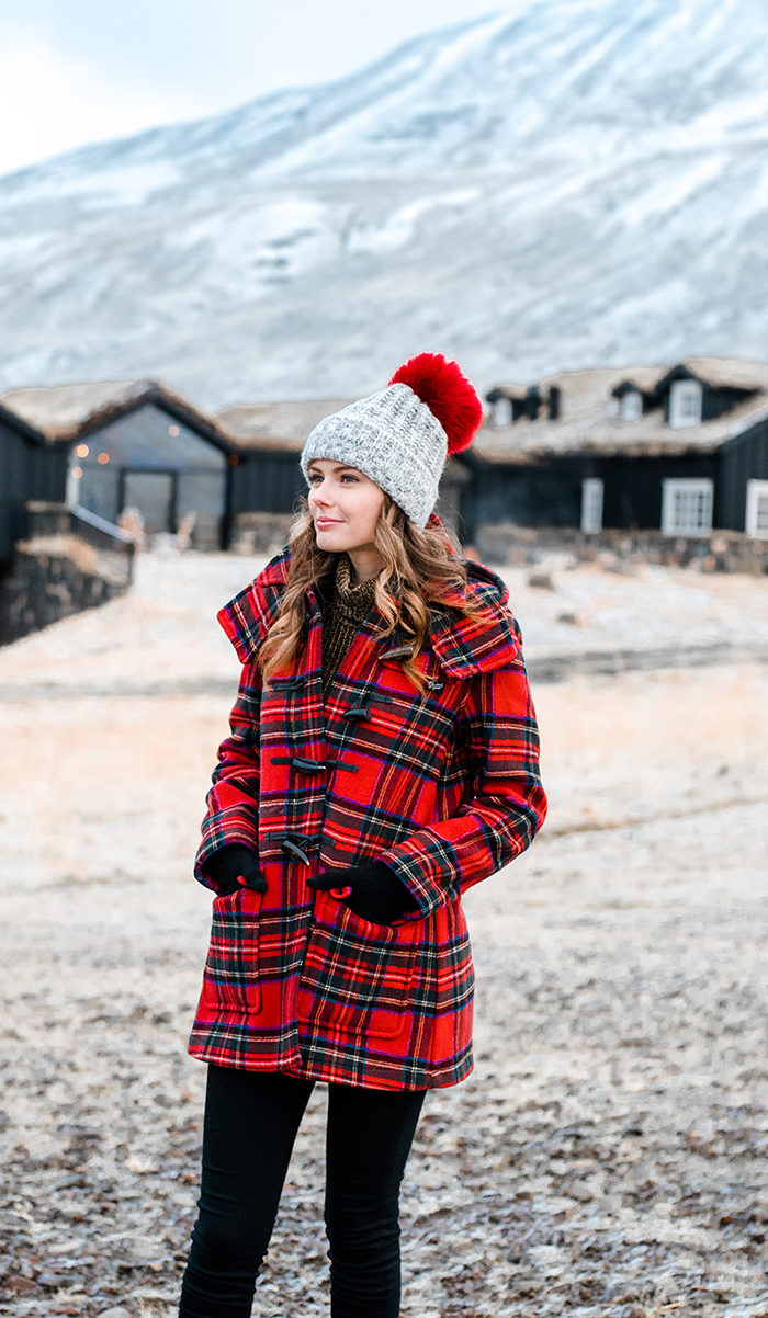 Alyssa Campanella of The A List blog visits Deplar Farm in northern Iceland wearing Gloverall plaid coat and Sorel Caribou boots
