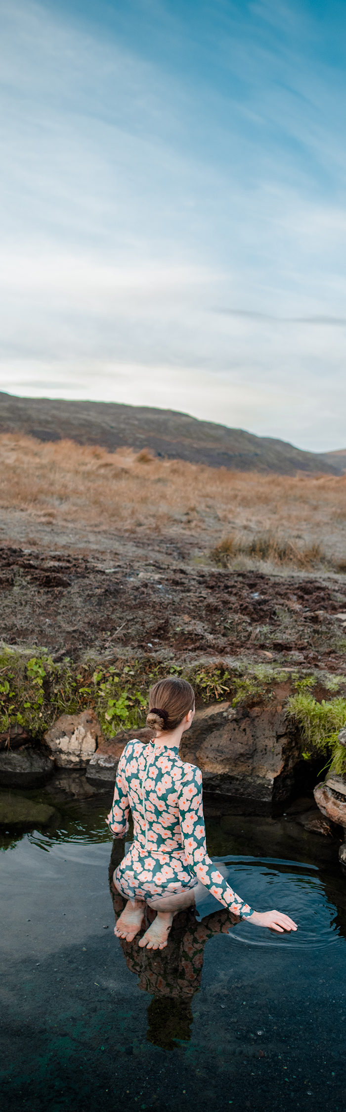 Alyssa Campanella visits Heydalur Guesthouse in Westfjords, Iceland wearing Acacia swim rashgaurd