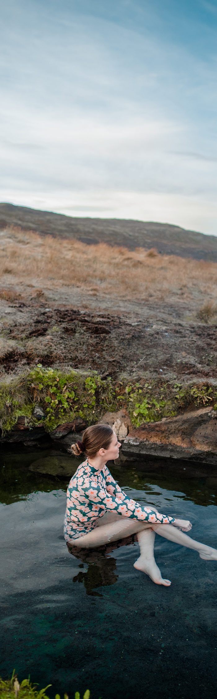 Alyssa Campanella visits Heydalur Guesthouse in Westfjords, Iceland wearing Acacia swim rashgaurd