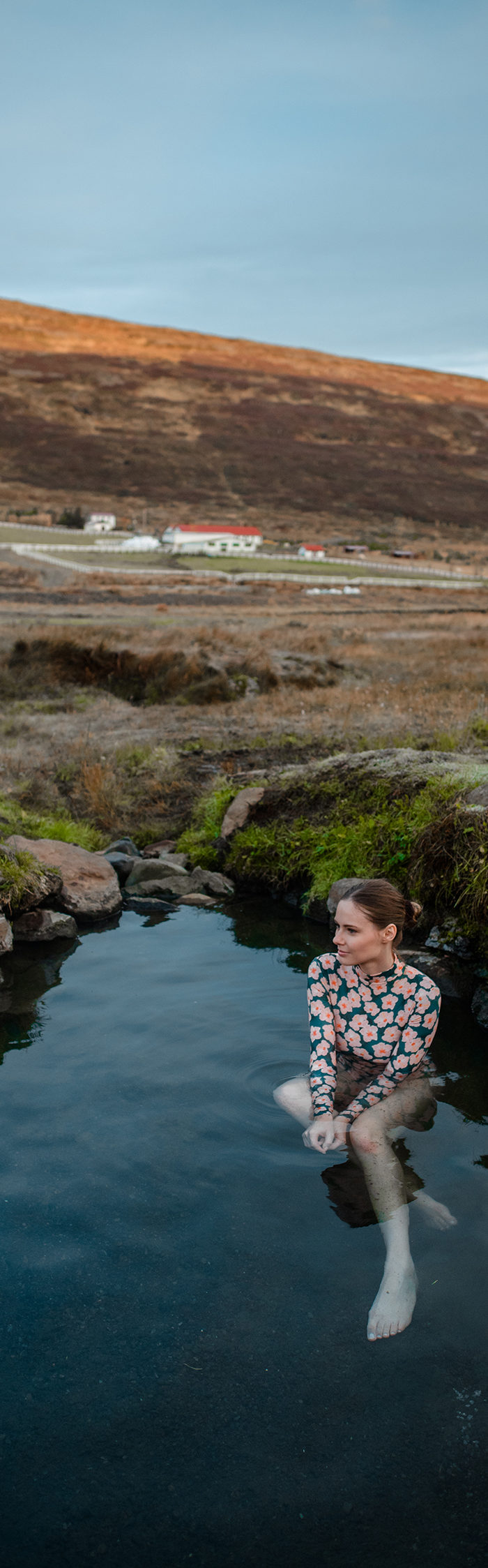 Alyssa Campanella visits Heydalur Guesthouse in Westfjords, Iceland wearing Acacia swim rashgaurd