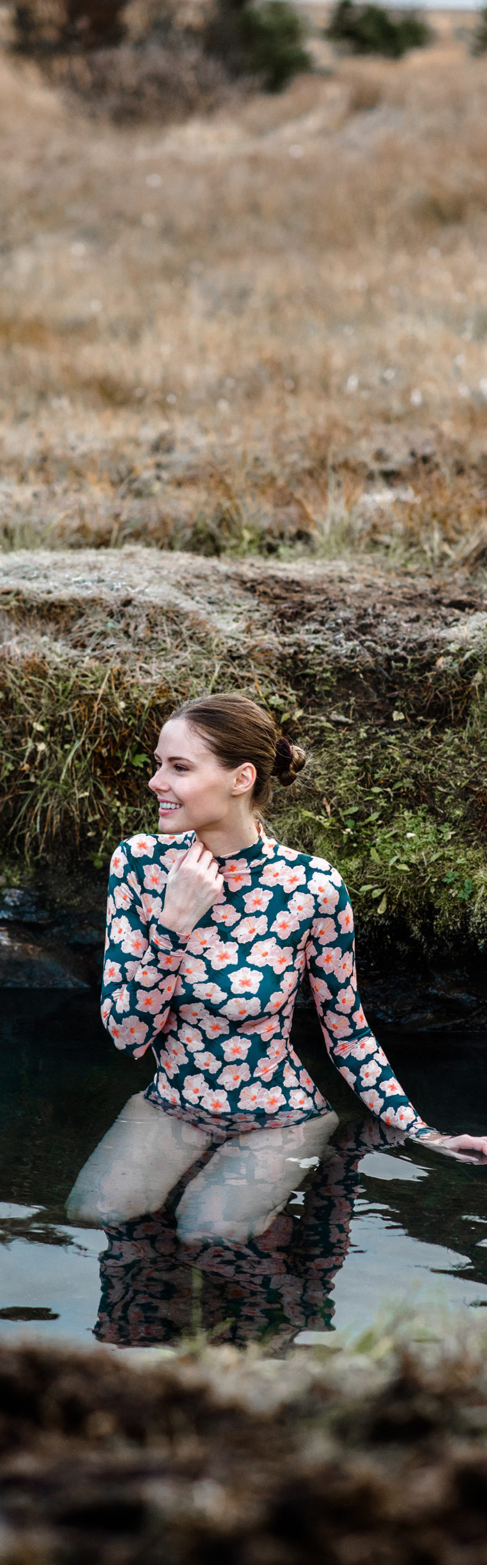 Alyssa Campanella visits Heydalur Guesthouse in Westfjords, Iceland wearing Acacia swim rashgaurd