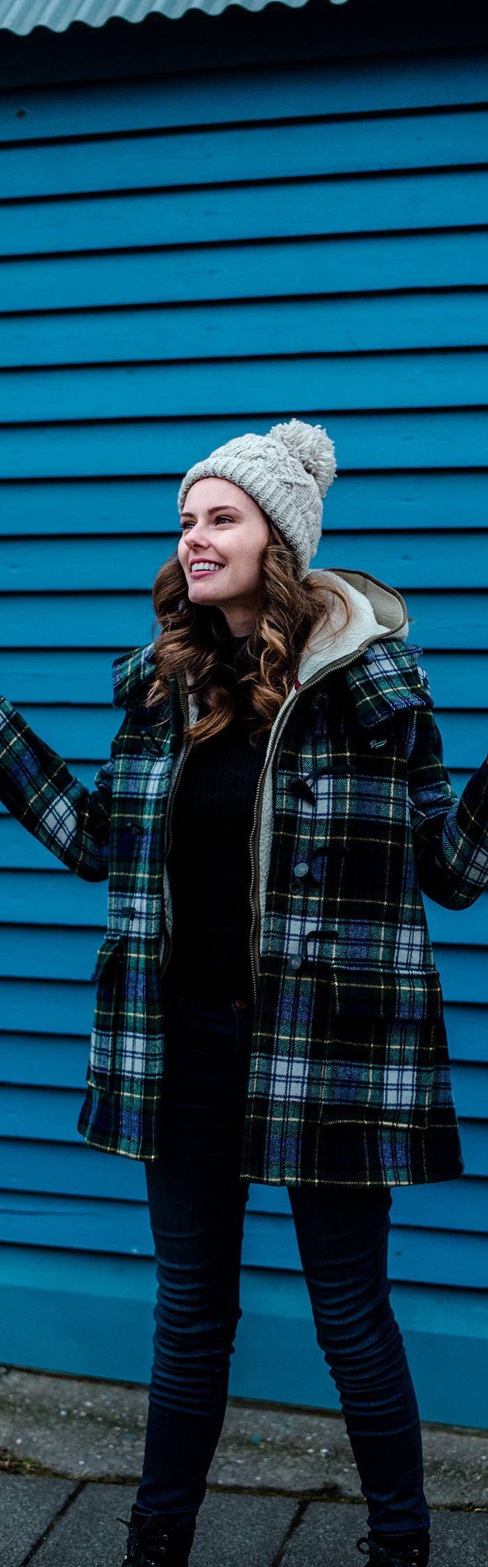 Alyssa Campanella visits Isafjordur in Westfjords, Iceland wearing Gloverall plaid duffle coat