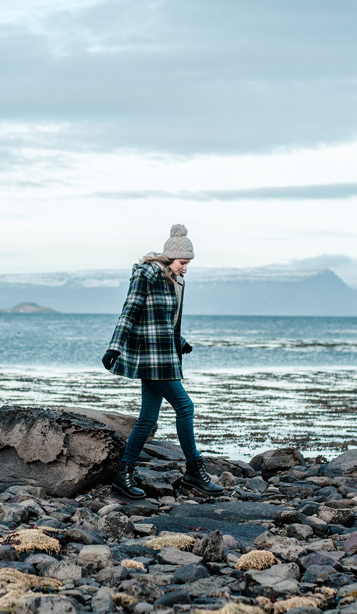 Alyssa Campanella visits Isafjordur in Westfjords, Iceland wearing Gloverall plaid duffle coat