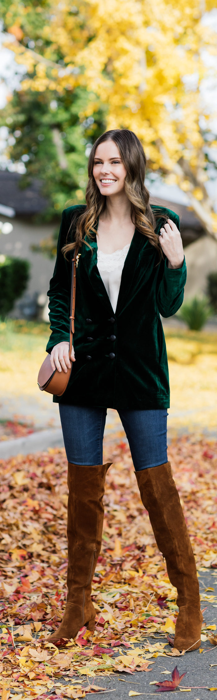 Alyssa Campanella of The A List blog shares the best velvet blazers for the holidays wearing On Parle de Vous green blazer, Cuyana mini saddle bag, and Sezane Emilie boots.