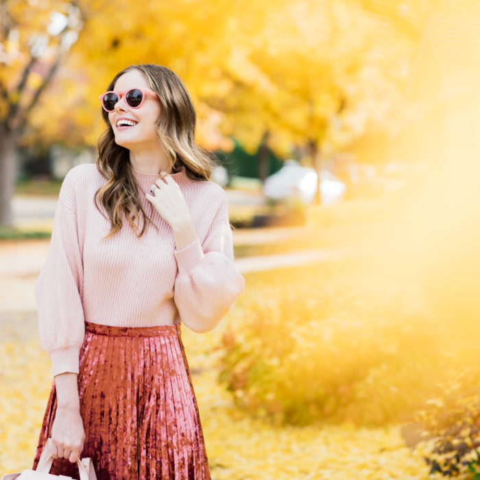 Alyssa Campanella of The A List blog wearing holiday pink in Glamorous velvet skirt, Line and Dot Alder sweater, Senreve Mini Maestra bag, and M. Gemi Corsa boots