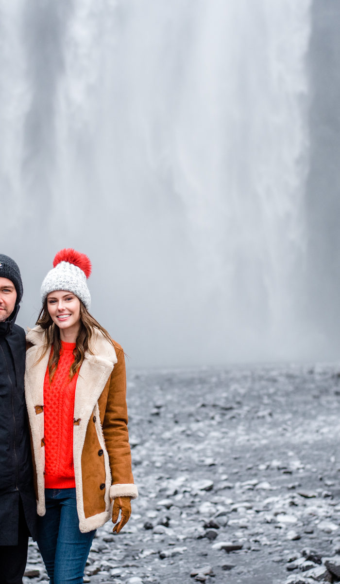 Torrance Coombs with wife Alyssa Campanella of The A List blog visits Skogáfoss in South Iceland wearing Danner Cascade boots, Topshop faux shearling coat, and ASOS red cable knit sweater.