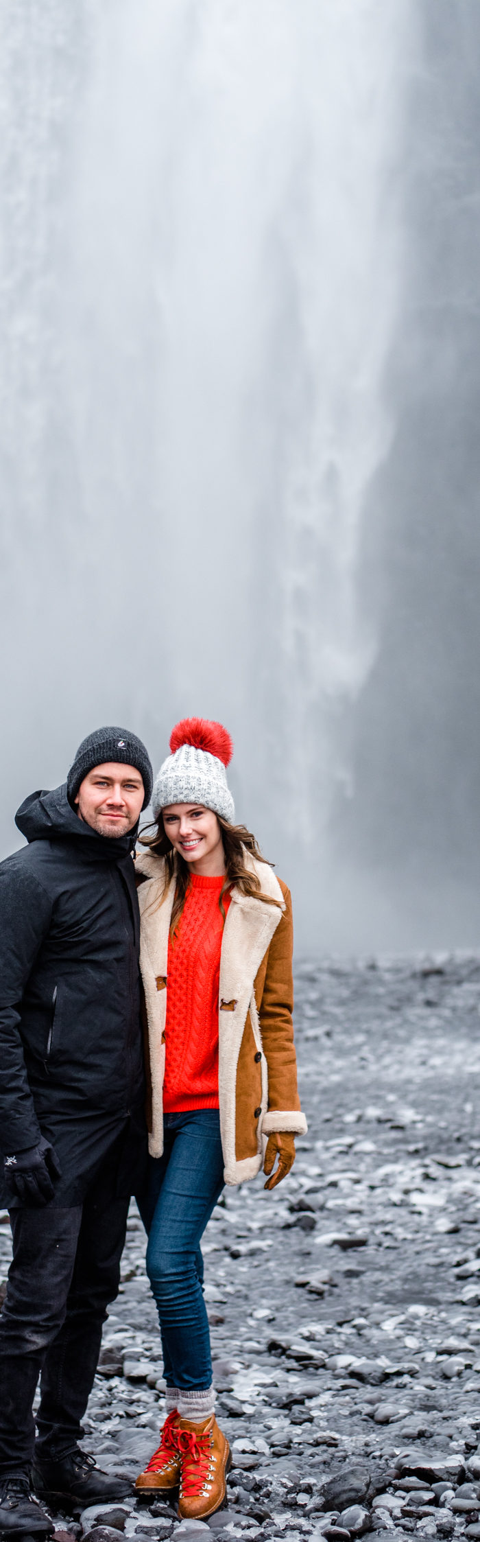 Torrance Coombs with wife Alyssa Campanella of The A List blog visits Skogáfoss in South Iceland wearing Danner Cascade boots, Topshop faux shearling coat, and ASOS red cable knit sweater.