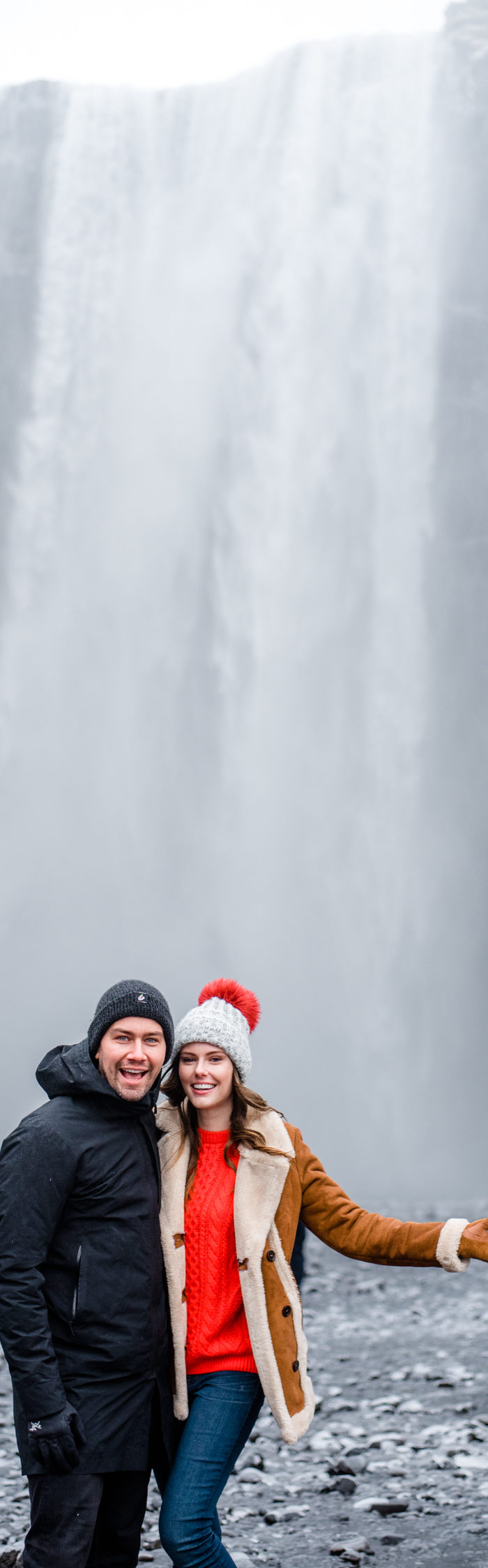 Torrance Coombs with wife Alyssa Campanella of The A List blog visits Skogáfoss in South Iceland wearing Danner Cascade boots, Topshop faux shearling coat, and ASOS red cable knit sweater.
