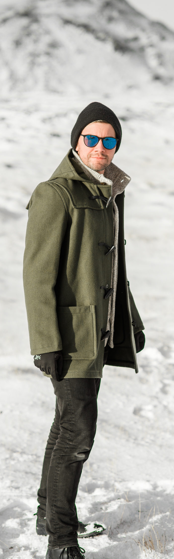 Torrance Coombs visits South Iceland with wife Alyssa Campanella, wearing Gloverall monty duffle coat