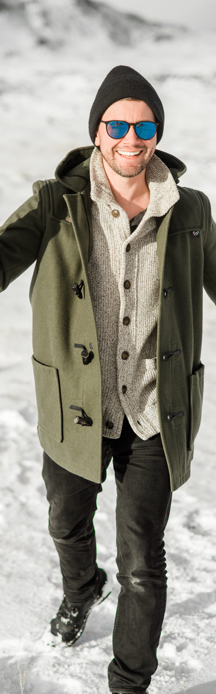 Torrance Coombs visits South Iceland with wife Alyssa Campanella, wearing Gloverall monty duffle coat