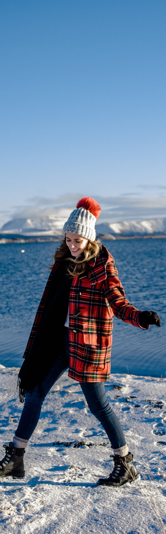 Alyssa Campanella of The A List blog visit Lake Myvatn on their road trip from Akureyri to Vik, Iceland wearing Gloverall plaid coat