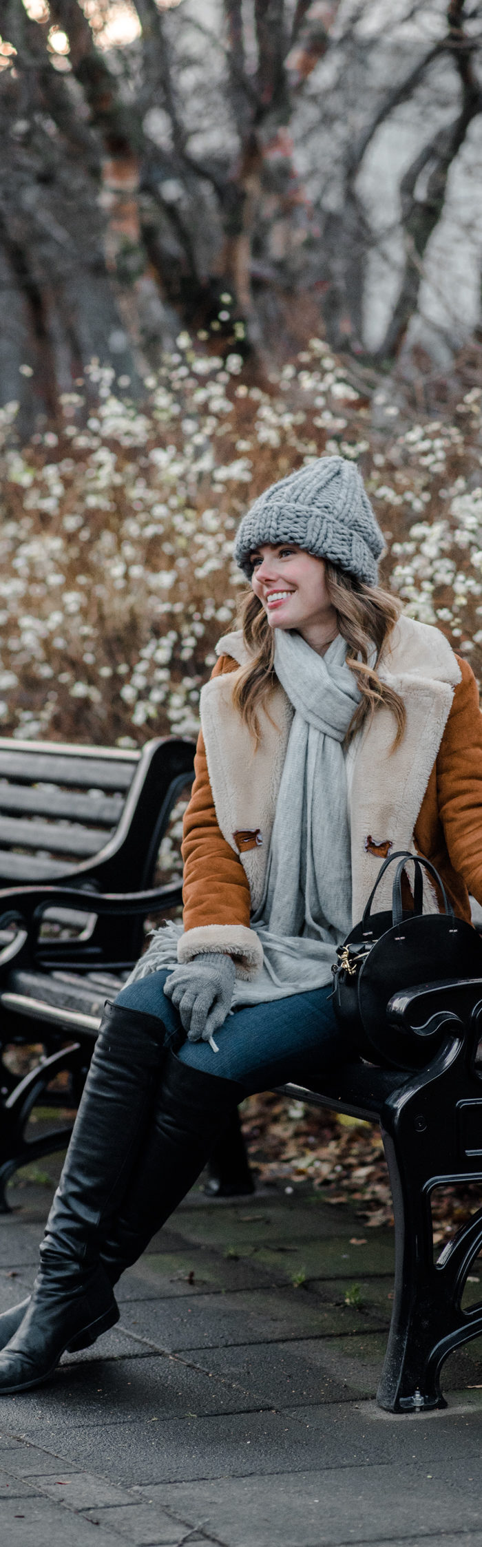 Alyssa Campanella of The A List blog visits Reykjavik, Iceland wearing Topshop Faux Shearling Coat, Clare V Alistair bag, and Stuart Weitzman 5050 boots.