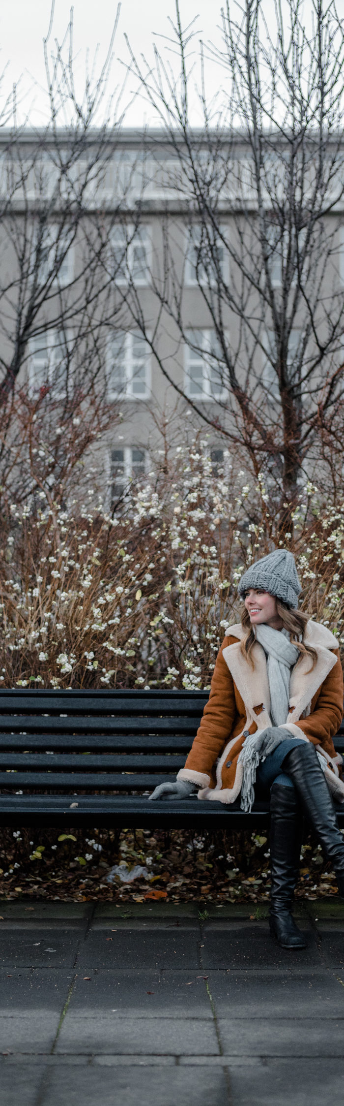 Alyssa Campanella of The A List blog visits Reykjavik, Iceland wearing Topshop Faux Shearling Coat, Clare V Alistair bag, and Stuart Weitzman 5050 boots.