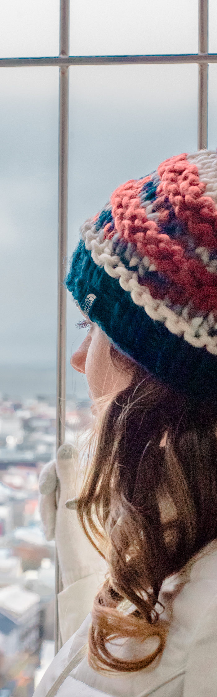 Alyssa Campanella of The A List blog visits Reykjavik, Iceland wearing Ellen Tracy faux fur coat, The North Face Nanny Knit Beanie, and Hunter Tour rainboots in Navy