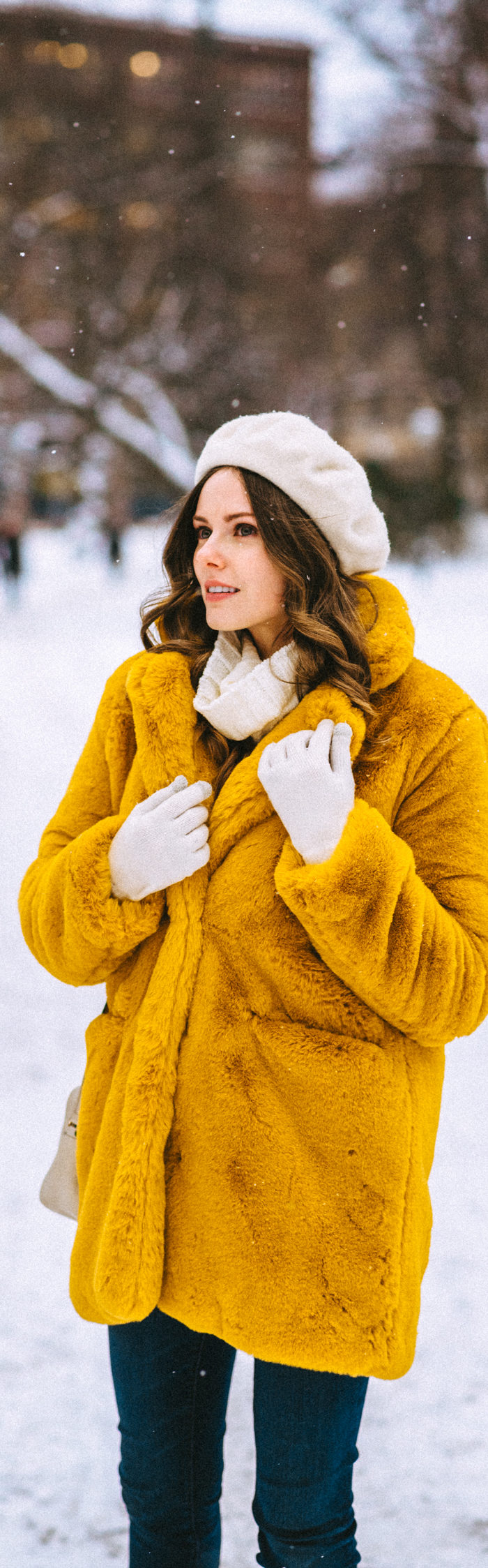Alyssa Campanella of The A List blog shares her Helsinki City Guide wearing a yellow faux fur coat and Frye Samantha boots