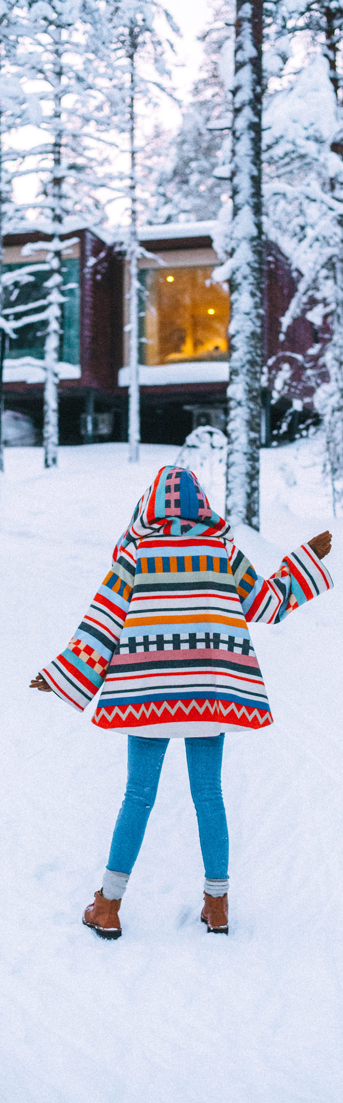 Alyssa Campanella of The A List blog visits Arctic Treehouse Hotel in Rovaniemi, Lapland, Finland wearing Lindsey Thornburg Taimaimi Trench Cloak