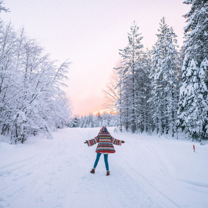Alyssa Campanella of The A List blog wearing Lindsey Thornburg Tamiami colorful trench cloak in Lapland, Finland