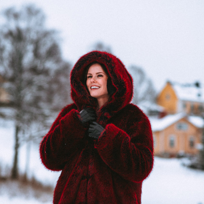 Alyssa Campanella of The A List blog wears the faux fur LPA Coat 84 and Marc Fisher Izzie boots while enjoying a day trip to Porvoo, Finland