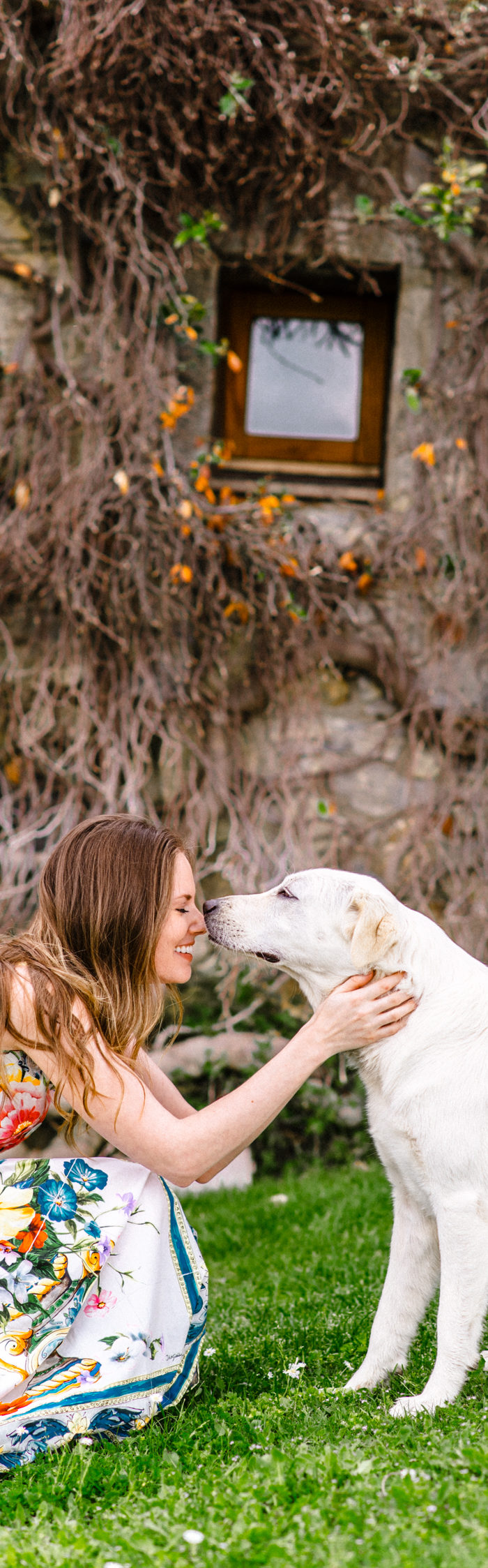 Alyssa Campanella of The A List visits Castello di Vicarello in Tuscany, Italy wearing Dolce & Gabbana Majolica dress