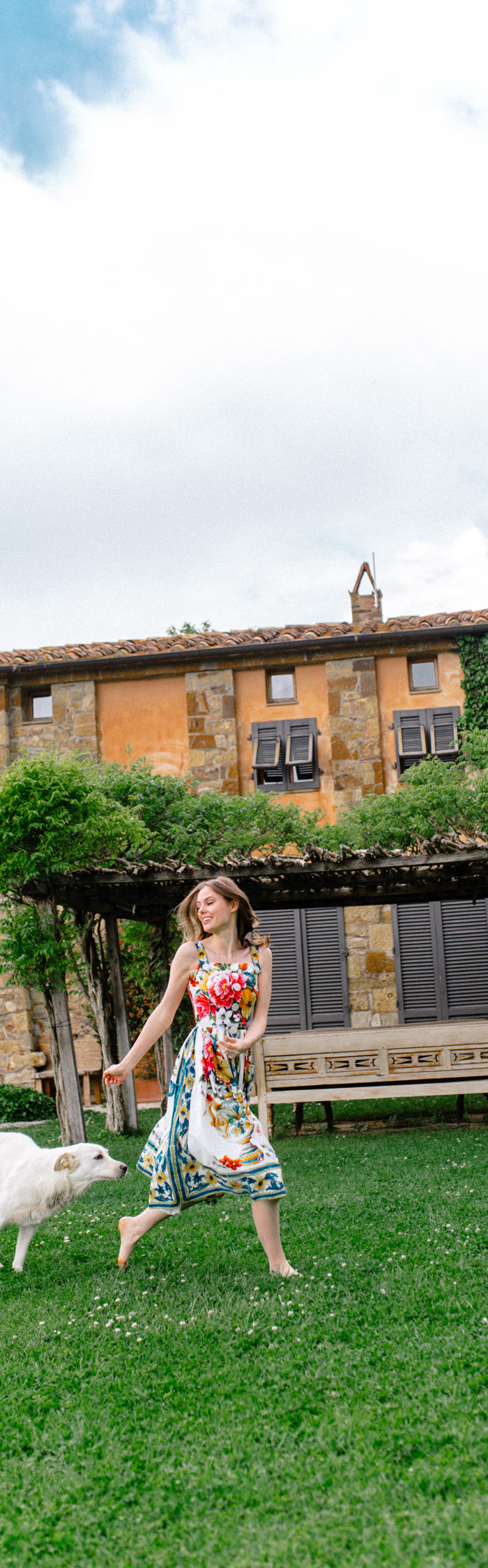 Alyssa Campanella of The A List visits Castello di Vicarello in Tuscany, Italy wearing Dolce & Gabbana Majolica dress