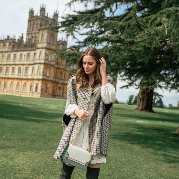 Alyssa Campanella of The A List blog visits Downton Abbey locations at Highclere Castle wearing RED Valentino plaid cape and Strathberry East West bag