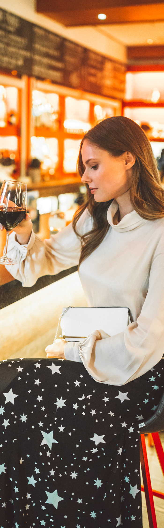 Alyssa Campanella of The A List shares her Whistler City Guide wearing LPA Top 340 and Lovers + Friends Hydra Skirt from Revolve at Cure Bar at Nita Lake Lodge