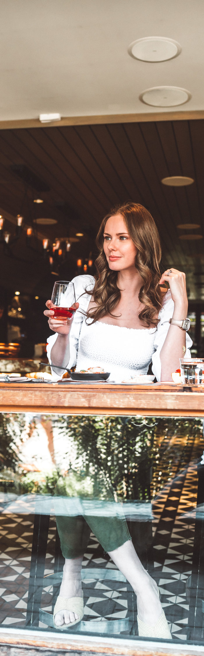 Alyssa Campanella of The A List shares her Whistler City Guide wearing Reformation Gala top and Michele Watches Diamond Deco watch at Bar Oso