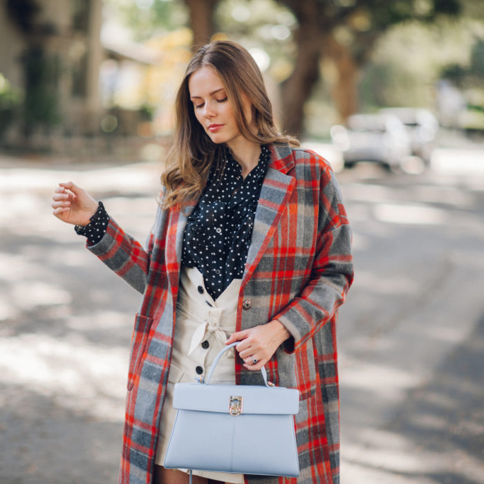 Alyssa Campanella of The A List blog shares her favorite plaid coats for fall wearing DRA plaid coat, Alexa Chung polka dot blouse, Lovers + Friends button up skirt, and Cafune small stance bag