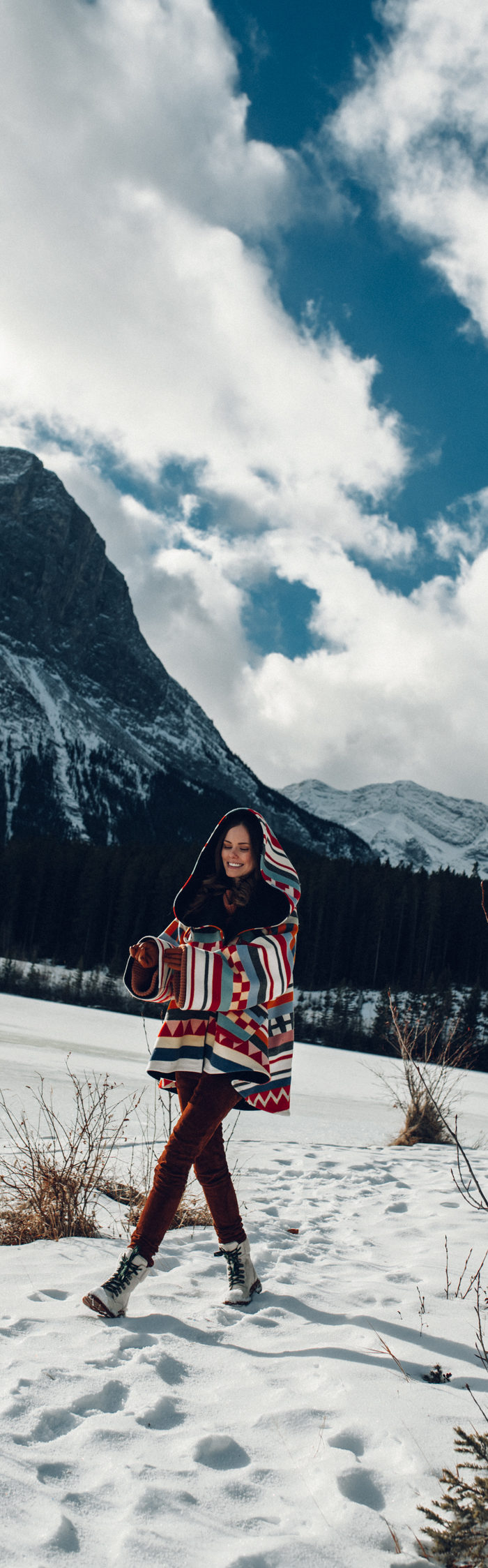 Alyssa Campanella of The A List blog sharing why I've stopped calling myself a blogger wearing Lindsey Thornburg cape in Alberta, Canada