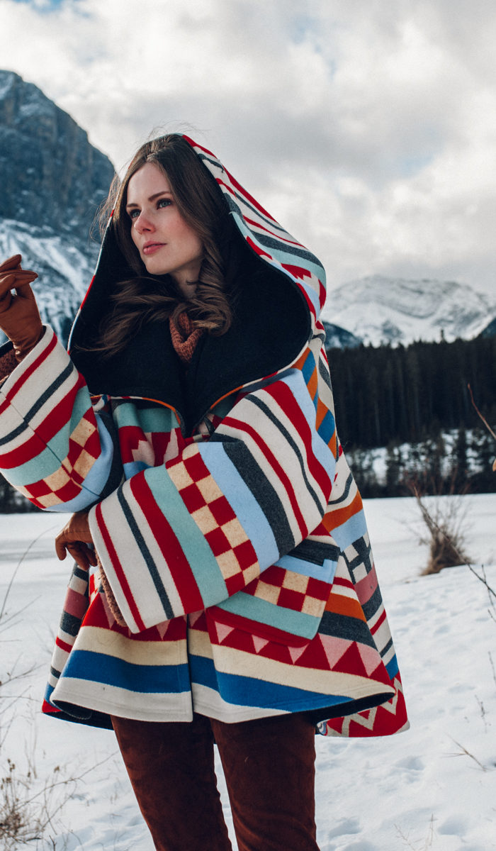 Alyssa Campanella of The A List blog sharing why I've stopped calling myself a blogger wearing Lindsey Thornburg cape in Alberta, Canada