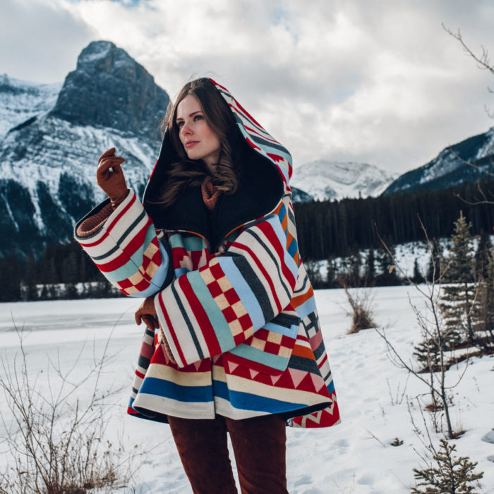 Alyssa Campanella of The A List blog sharing why I've stopped calling myself a blogger wearing Lindsey Thornburg cape in Alberta, Canada