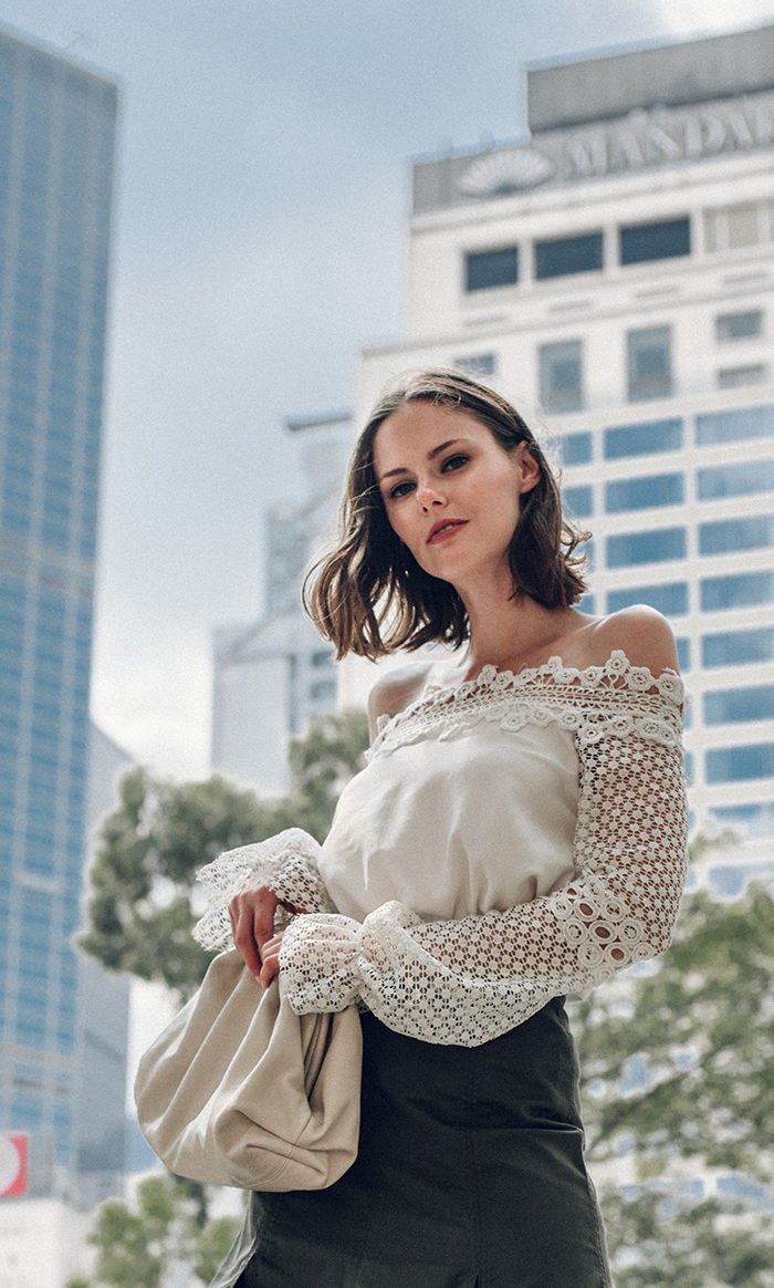 Miss USA 2011 Alyssa Campanella of The A List blog visits Mandarin Oriental Hong Kong wearing Bottega Veneta The Pouch bag in mist and Silvia Tcherassi skirt and Mango snakeskin boots