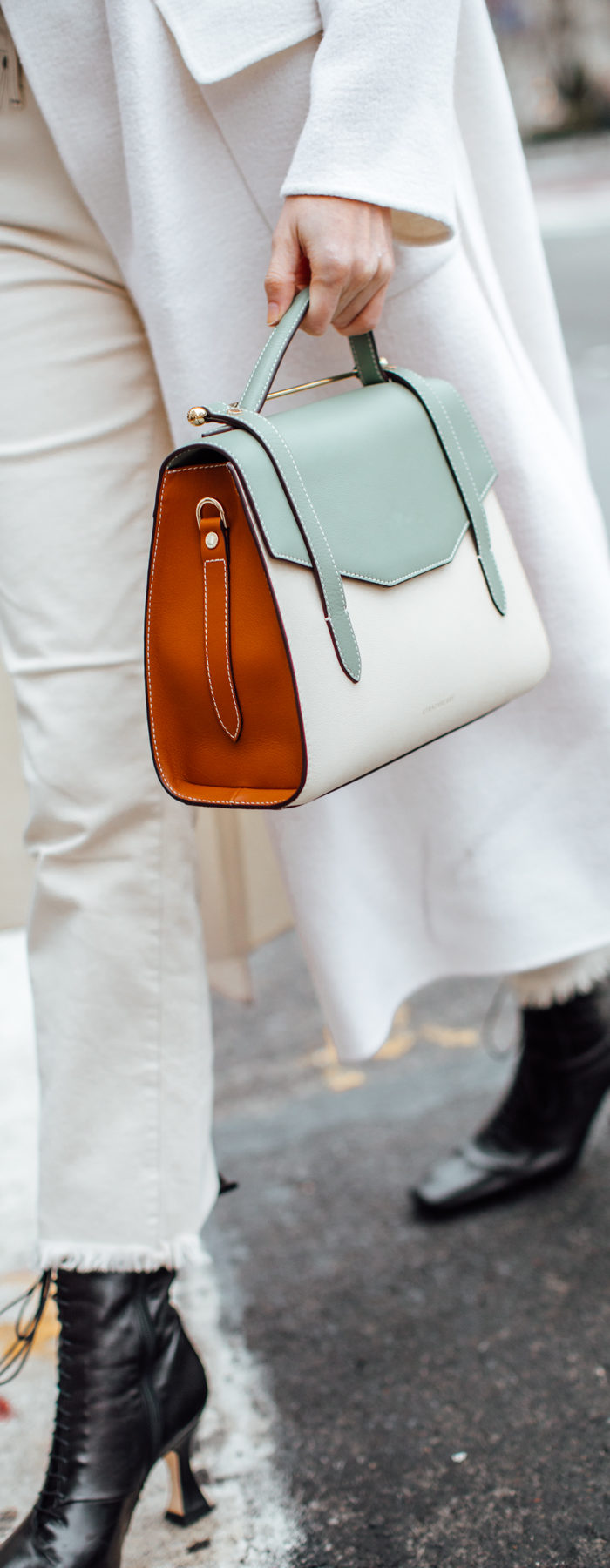 Alyssa Campanella of The A List blog shares her favorite restaurants in New York wearing Zimmermann suraya top, Strathberry midi allegro bag, and Miista yana boots.