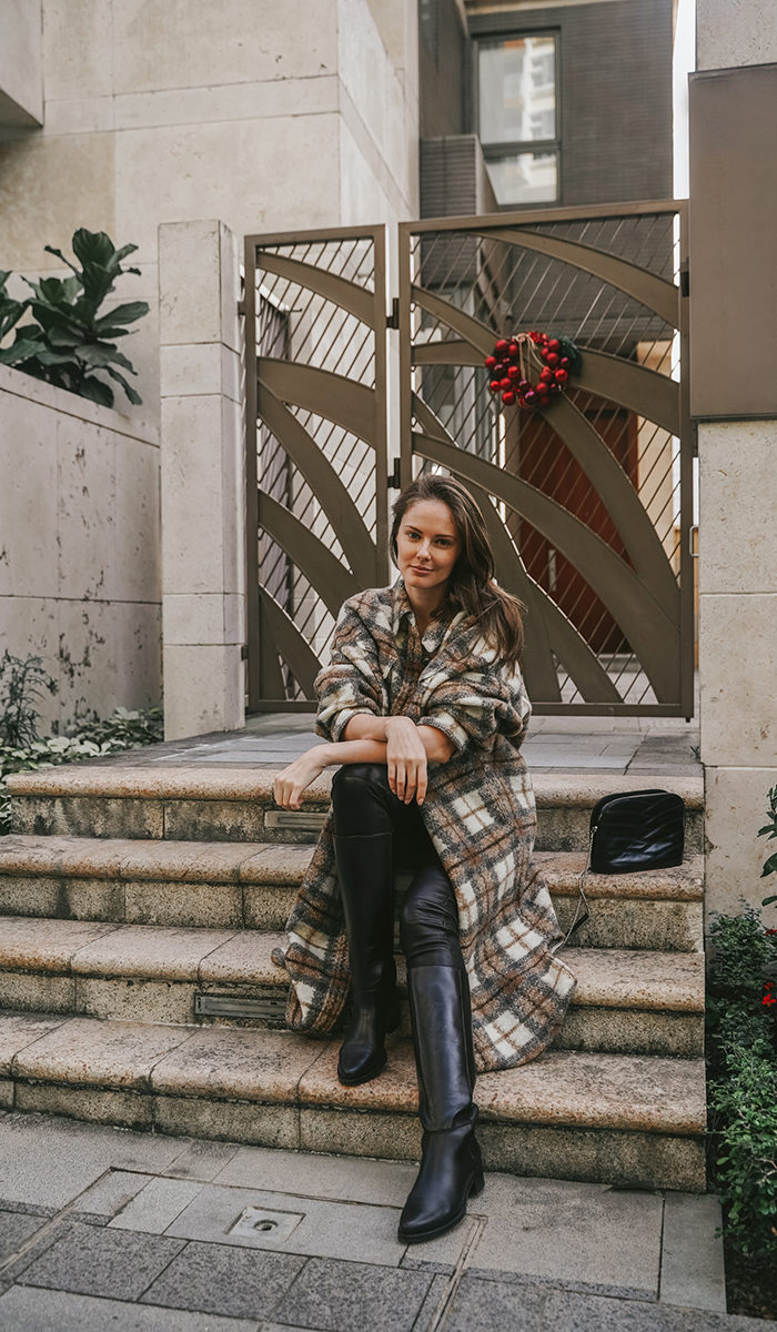 Alyssa Campanella of The A List blog shares her daily looks wearing Isabel Marant Gabrion coat, Legres boots, Helmut Lang leather pants, and Sezane Victor bag