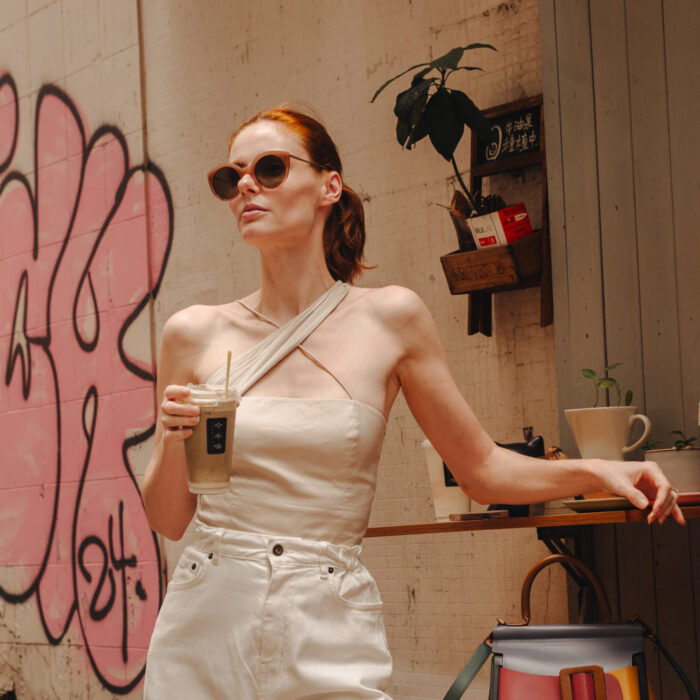 Miss USA 2011 Alyssa Campanella drinks hojicha lattes in Hong Kong wearing Zeynep Arcay top, The Frankie Shop jeans, and Boyy Bobby bag